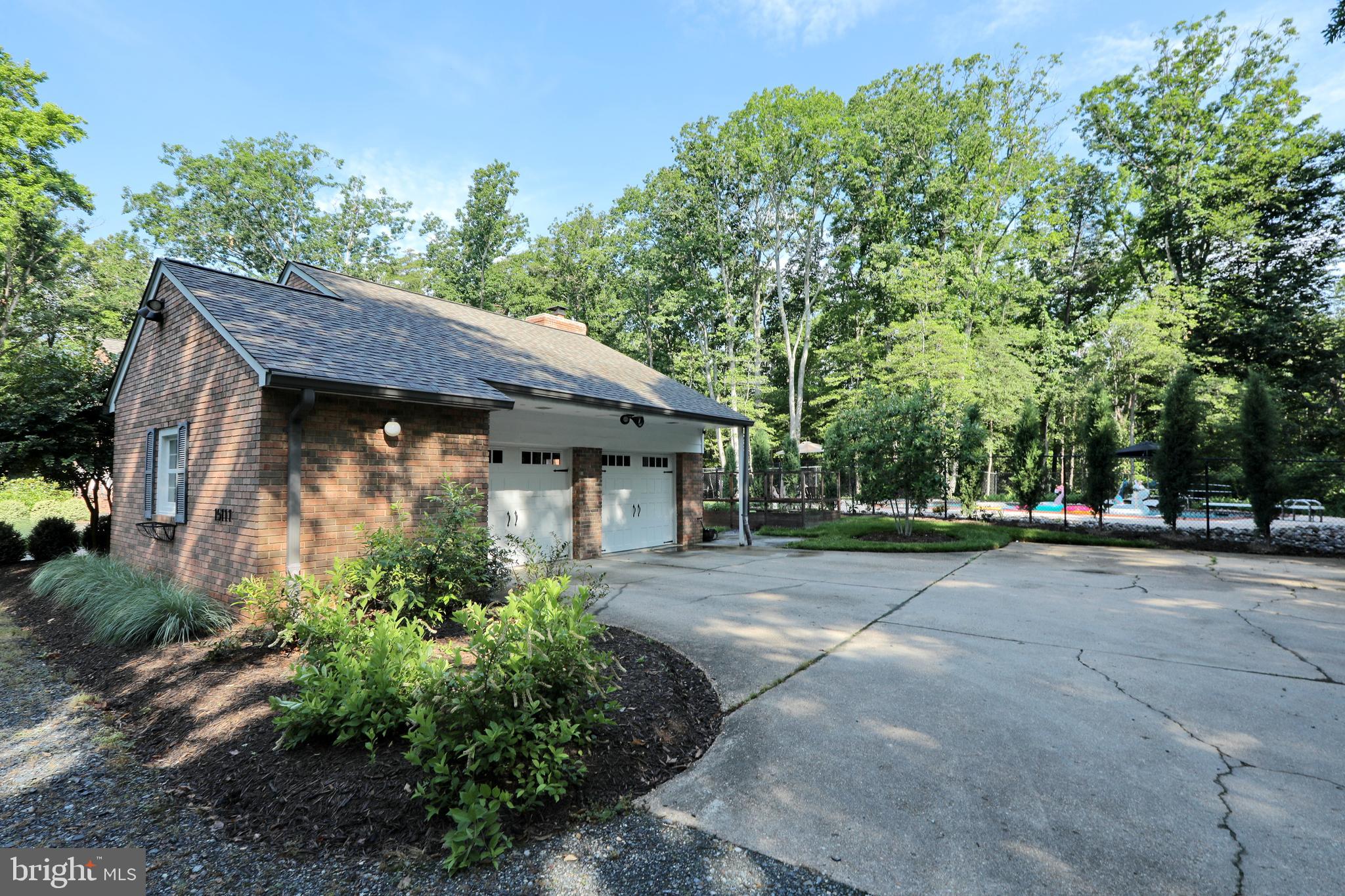 15111 Cactus Hill Road Accokeek, MD 20607 - Photo 11 of 44 a view of a house with a plants and large tree