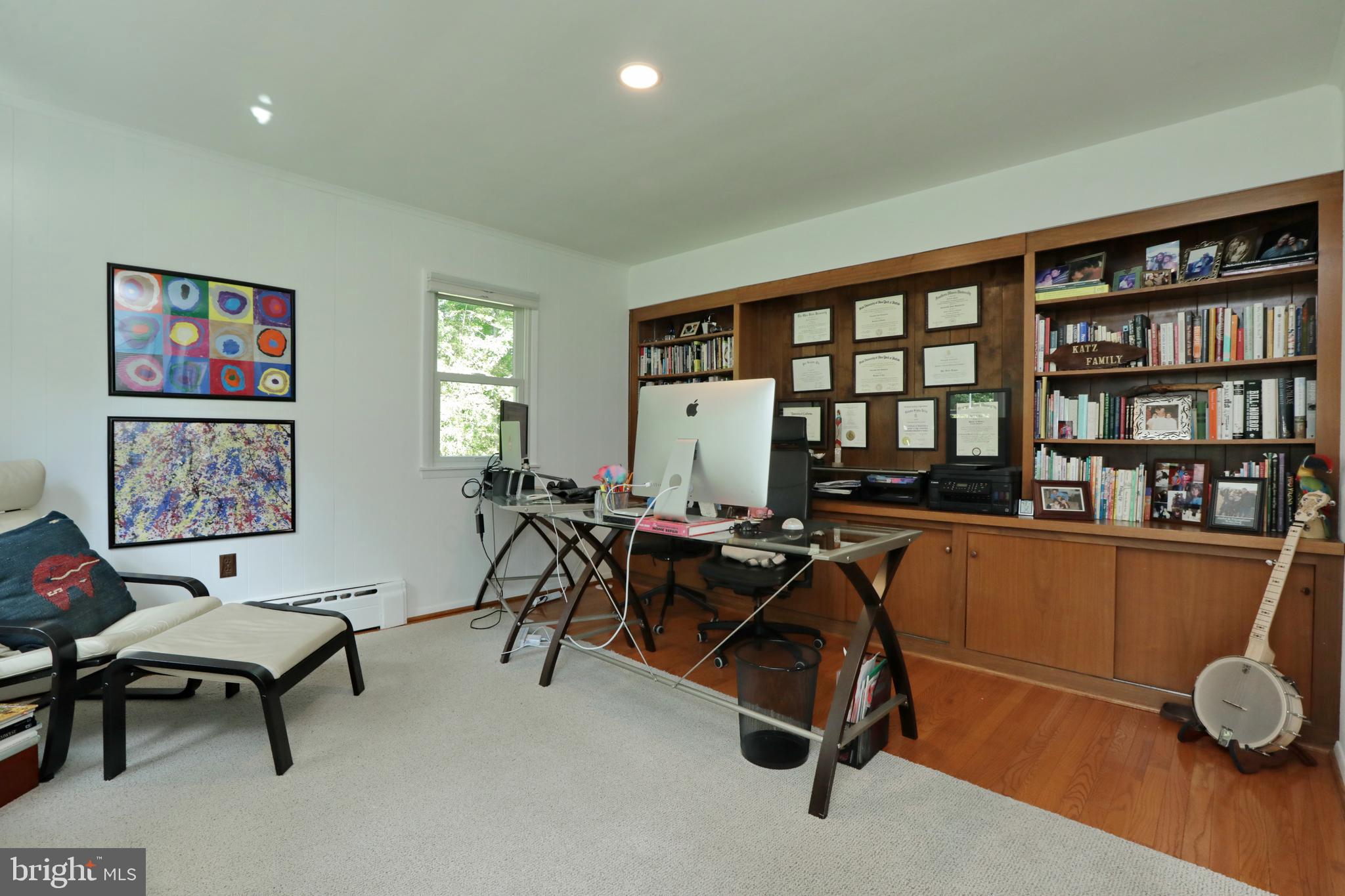 15111 Cactus Hill Road Accokeek, MD 20607 - Photo 15 of 44 a living room with furniture a bookshelf and a window