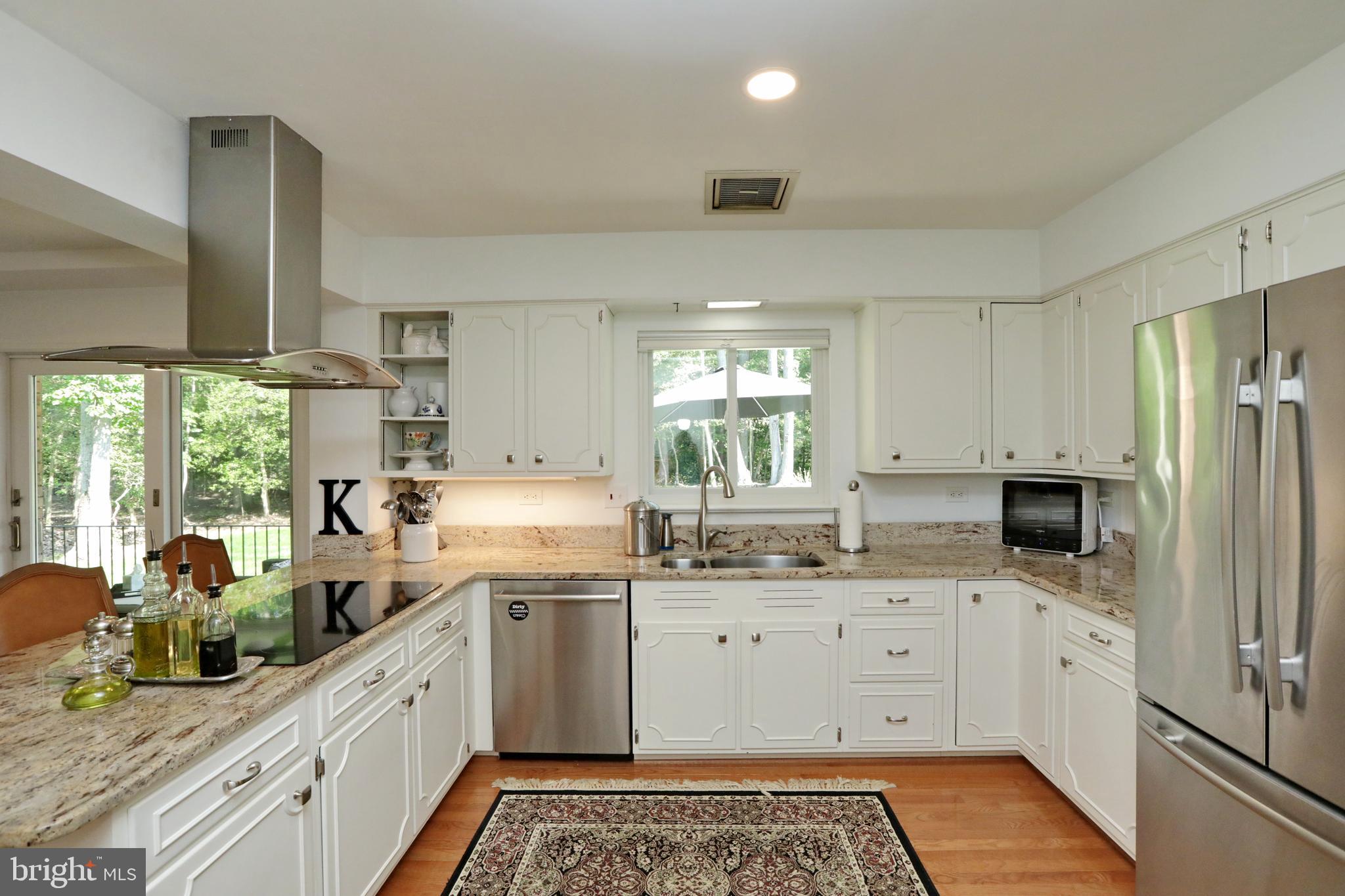 15111 Cactus Hill Road Accokeek, MD 20607 - Photo 18 of 44 a kitchen with a sink stove and refrigerator