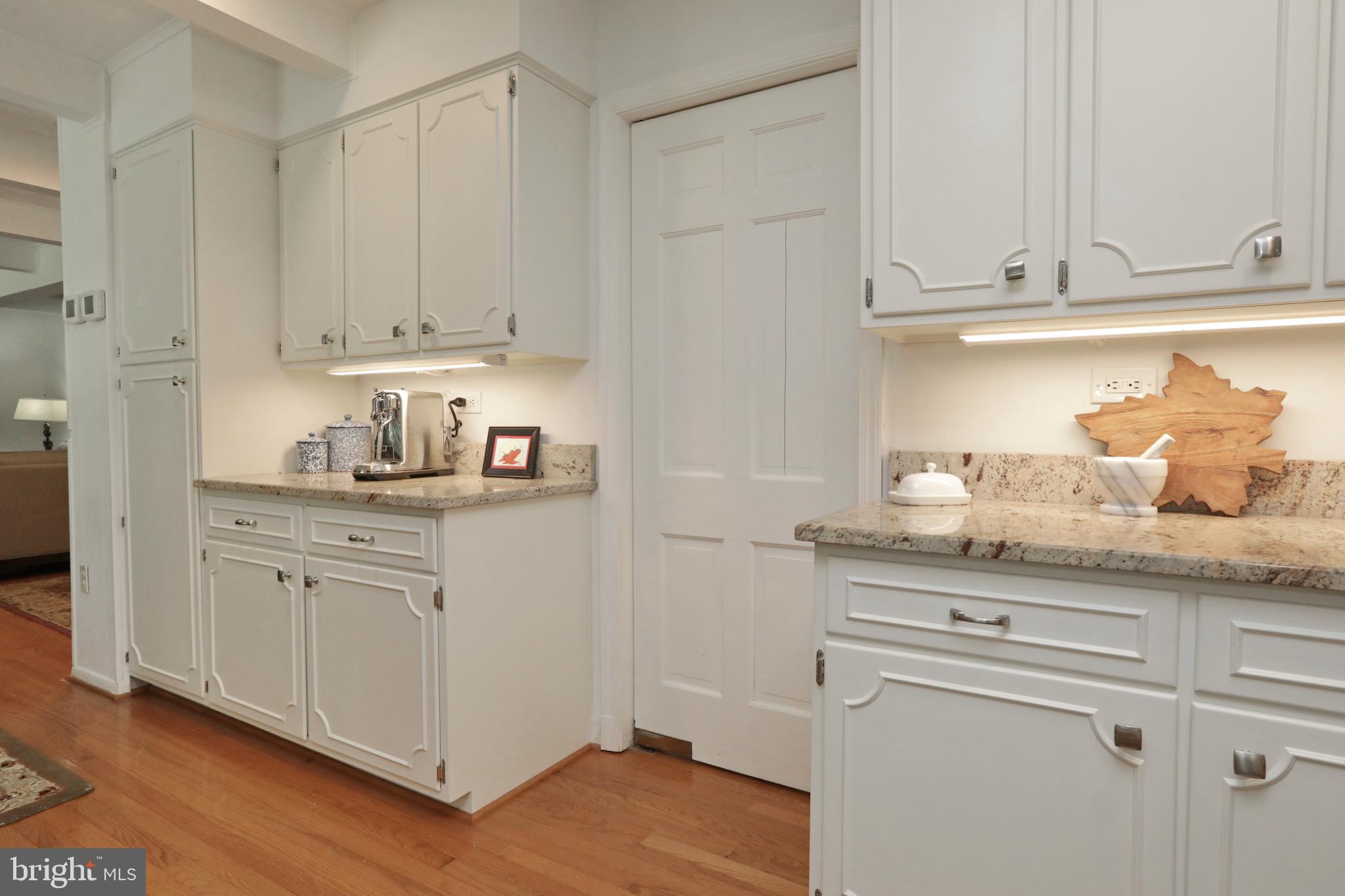 15111 Cactus Hill Road Accokeek, MD 20607 - Photo 21 of 44 a kitchen with granite countertop white cabinets and white appliances