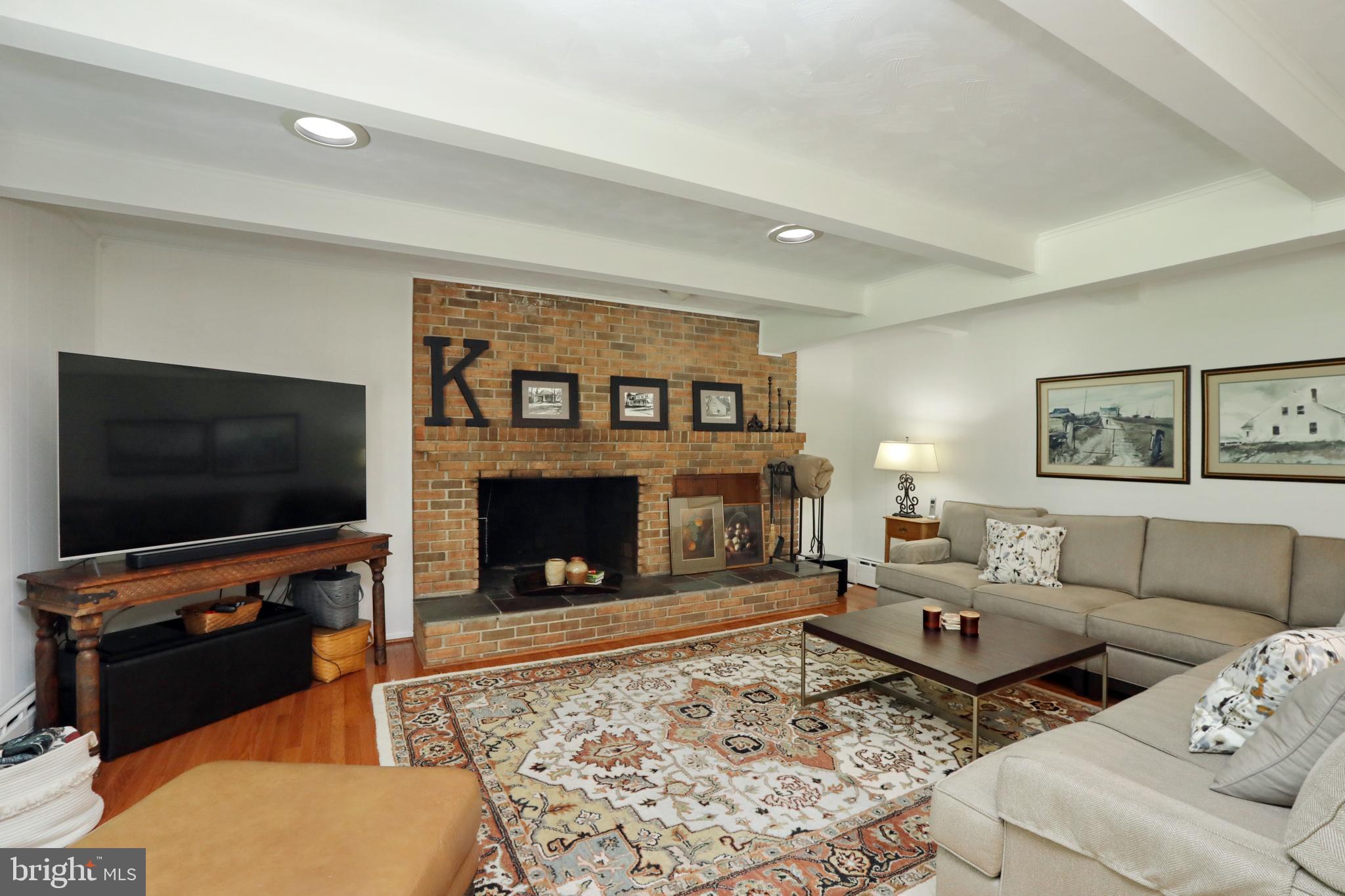 15111 Cactus Hill Road Accokeek, MD 20607 - Photo 22 of 44 a living room with furniture and a fireplace