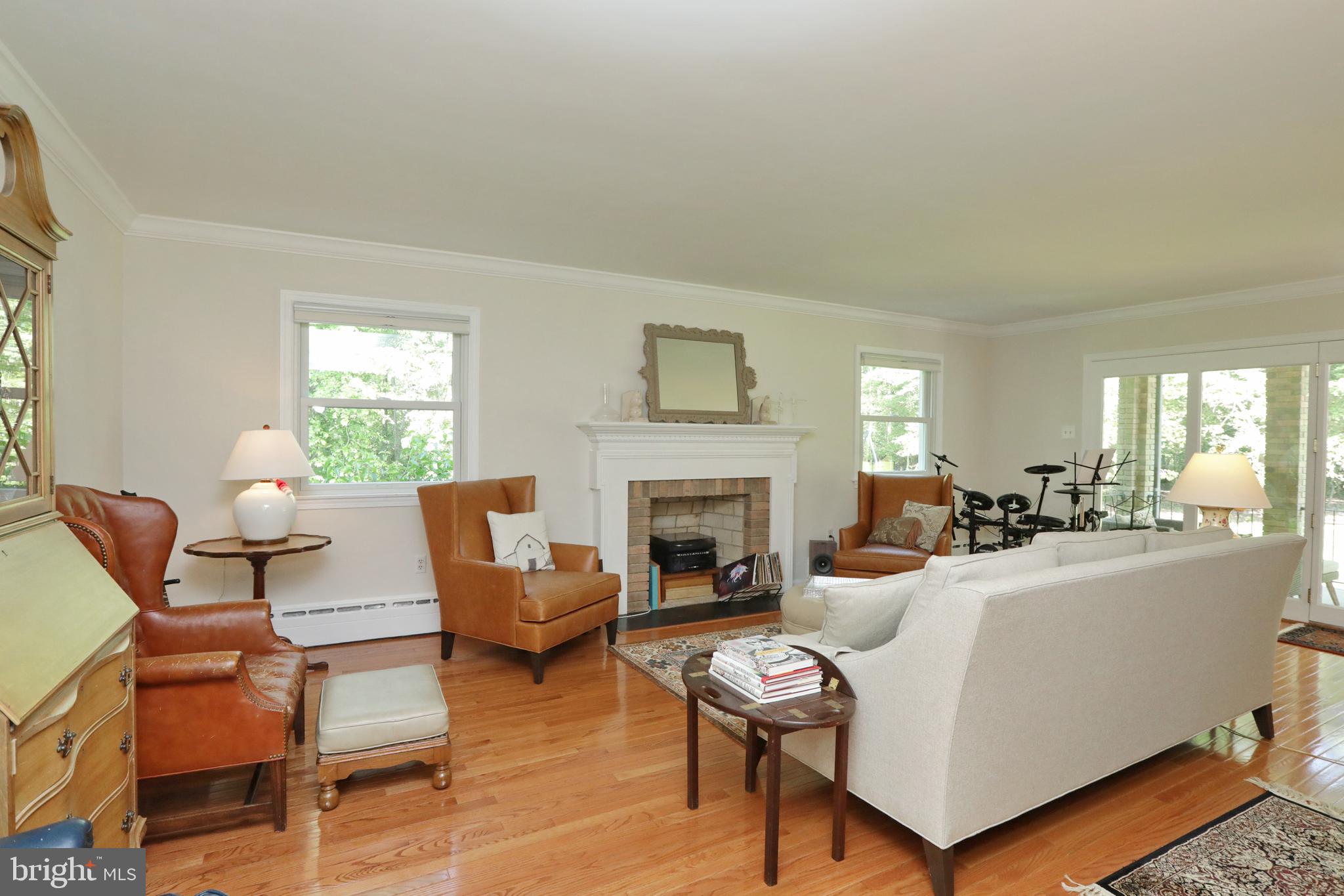 15111 Cactus Hill Road Accokeek, MD 20607 - Photo 25 of 44 a living room with furniture fireplace and a table