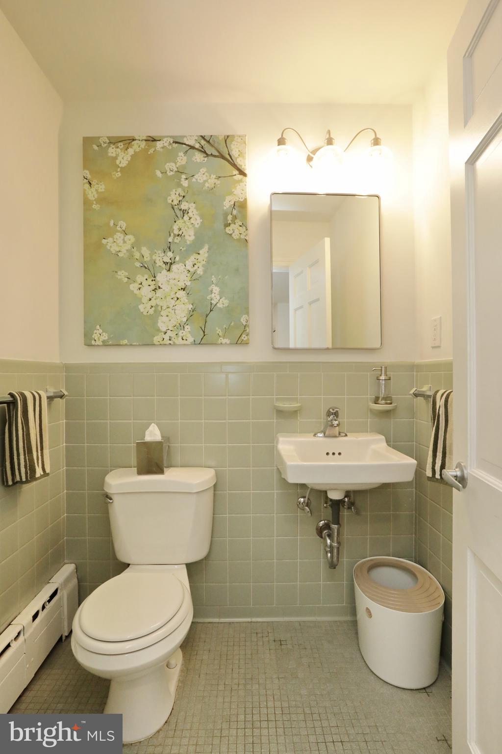 15111 Cactus Hill Road Accokeek, MD 20607 - Photo 27 of 44 a bathroom with a toilet sink and mirror