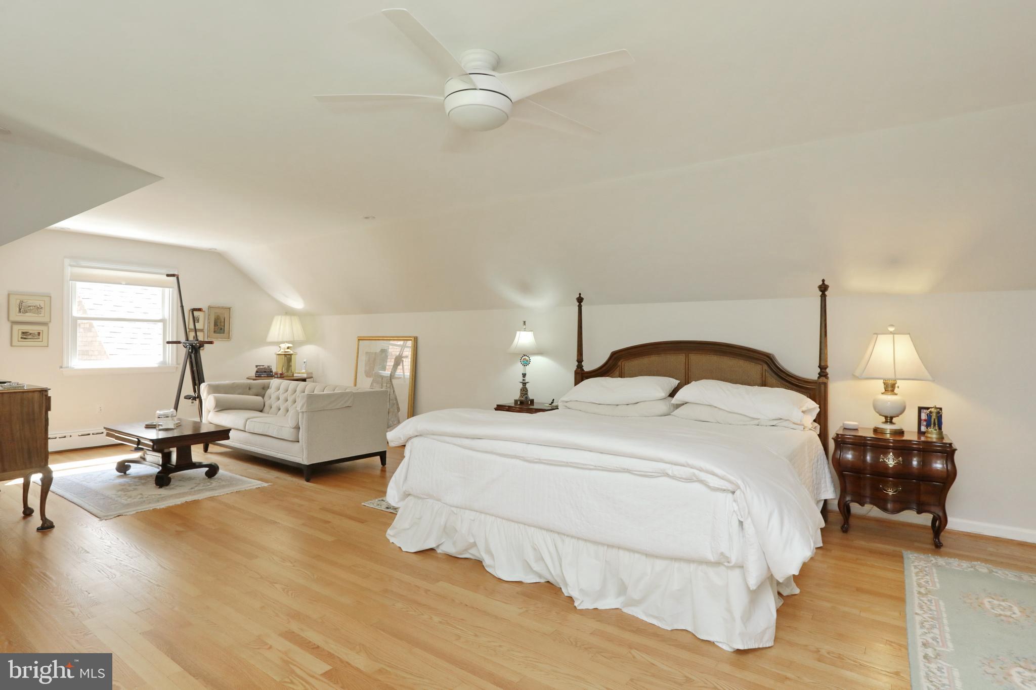 15111 Cactus Hill Road Accokeek, MD 20607 - Photo 30 of 44 a bedroom with a bed couch and a chandelier