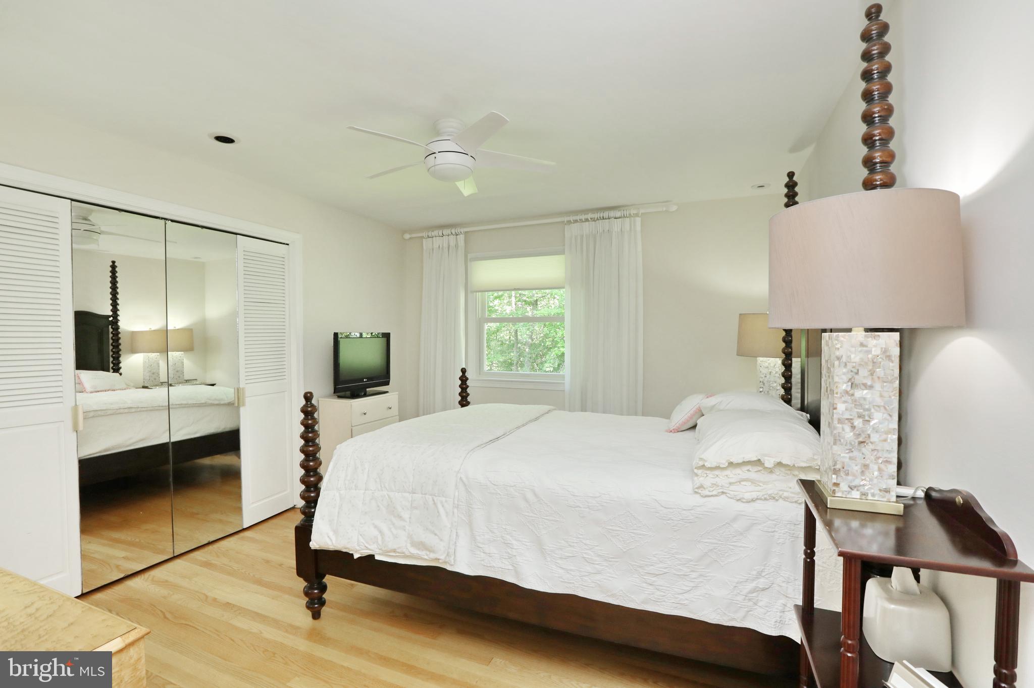 15111 Cactus Hill Road Accokeek, MD 20607 - Photo 36 of 44 a bedroom with a bed and a mirror