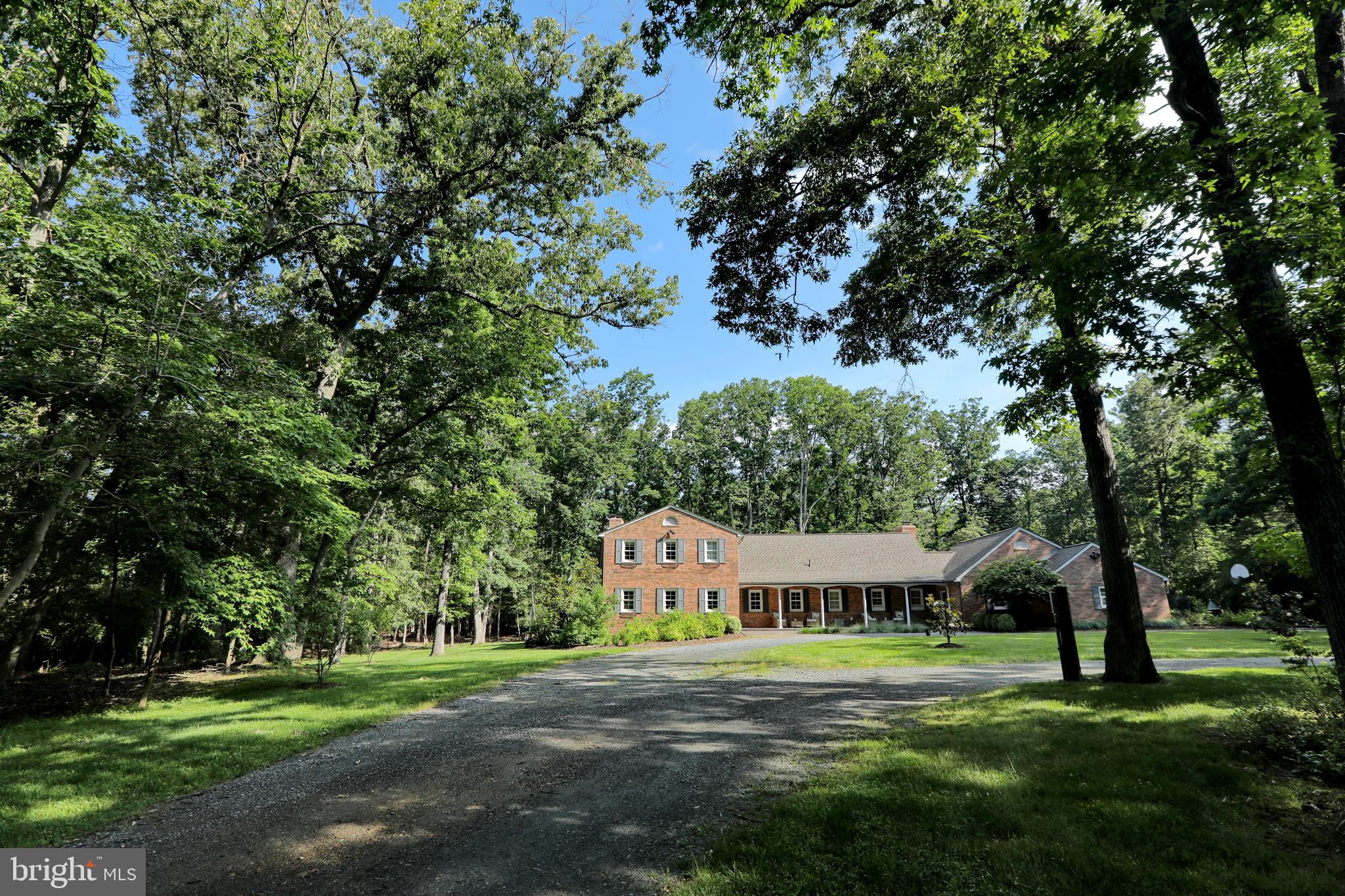 15111 Cactus Hill Road Accokeek, MD 20607 - Photo 43 of 44 a view of a big house with a big yard and large trees