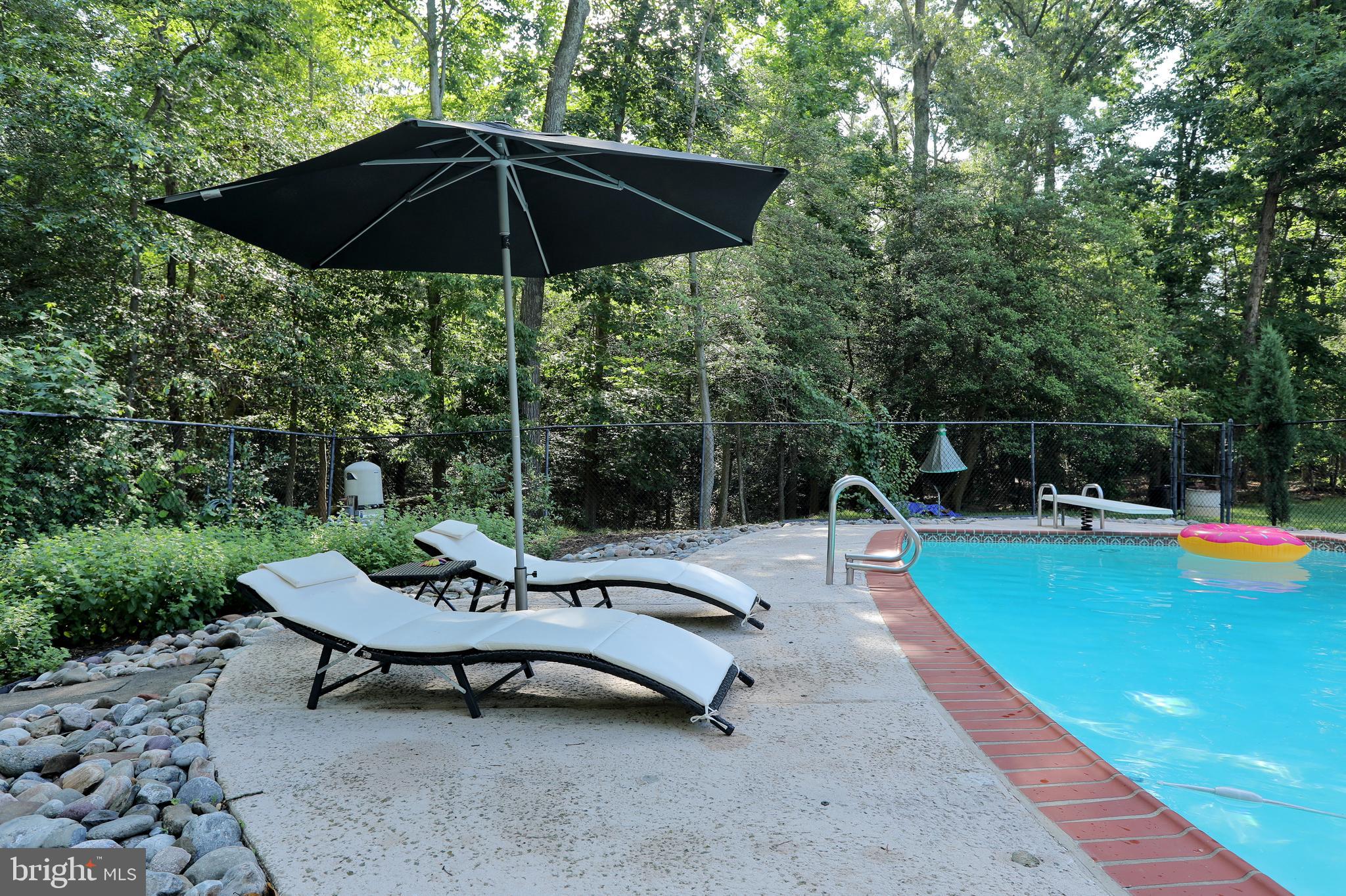 15111 Cactus Hill Road Accokeek, MD 20607 - Photo 9 of 44 a view of a swimming pool with a patio