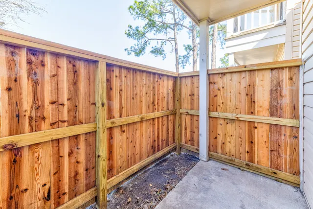 a view of a porch with wooden floor
