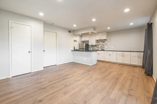 a view of kitchen with wooden floor