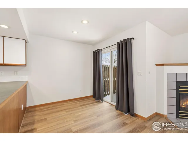 a kitchen with refrigerator and cabinets