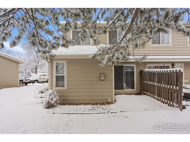 a front view of a house with a yard and seating space