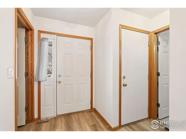a view of entryway with wooden floor