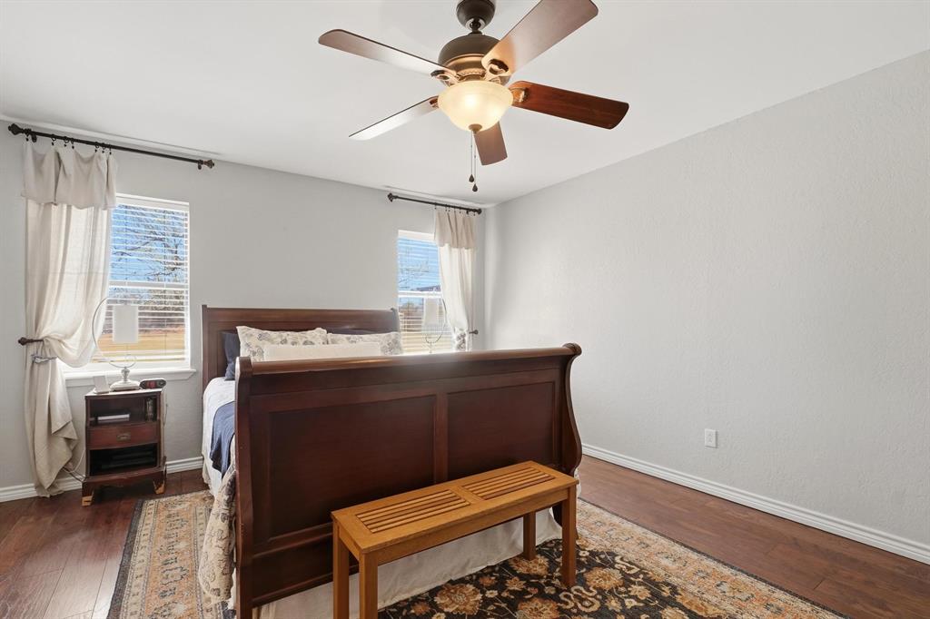 121 Sandy Lane Clyde, TX 79510 - Photo 16 of 30 a room with wooden furniture and windows