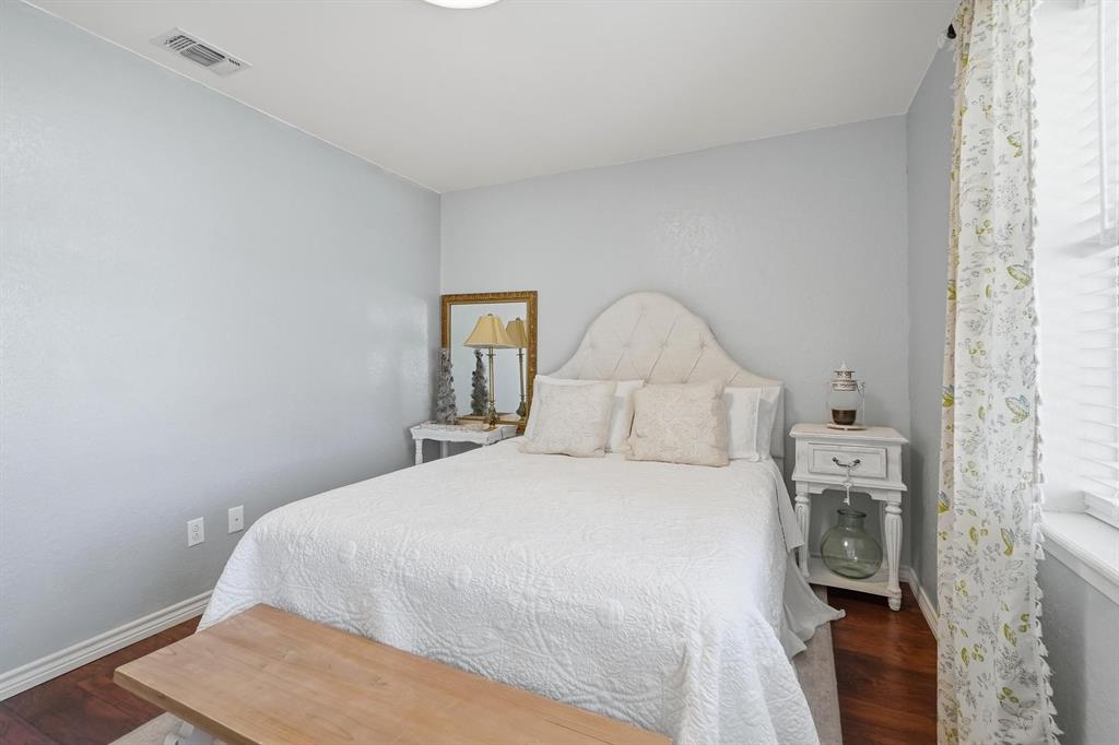121 Sandy Lane Clyde, TX 79510 - Photo 20 of 30 a bedroom with a bed and a tv