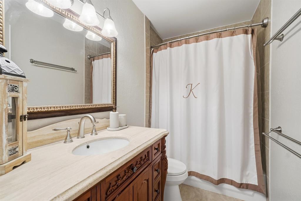 121 Sandy Lane Clyde, TX 79510 - Photo 22 of 30 a bathroom with a double vanity sink and a mirror