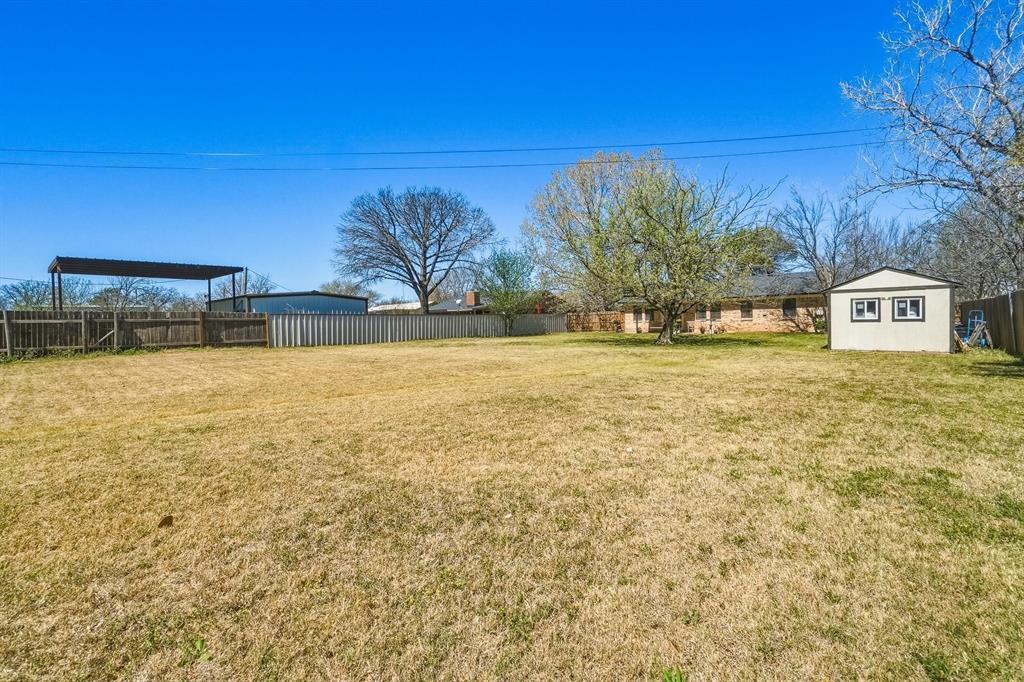 121 Sandy Lane Clyde, TX 79510 - Photo 29 of 30 a view of a swimming pool with an outdoor space and seating area