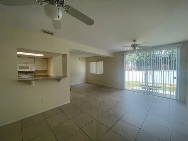 a kitchen with a stove top oven and cabinets
