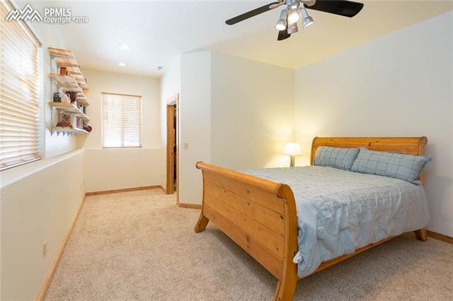 17873 Sawmill Road Colorado Springs, CO 80908 - Photo 27 of 36 Basement bedroom with walk-in closet and shelves