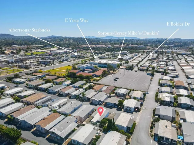 a view of residential houses with outdoor space