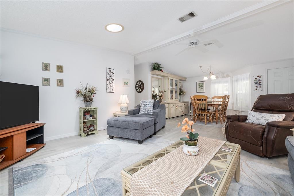 501 Topside Circle Edgewater, FL 32141 - Photo 12 of 47 a living room with furniture and a flat screen tv