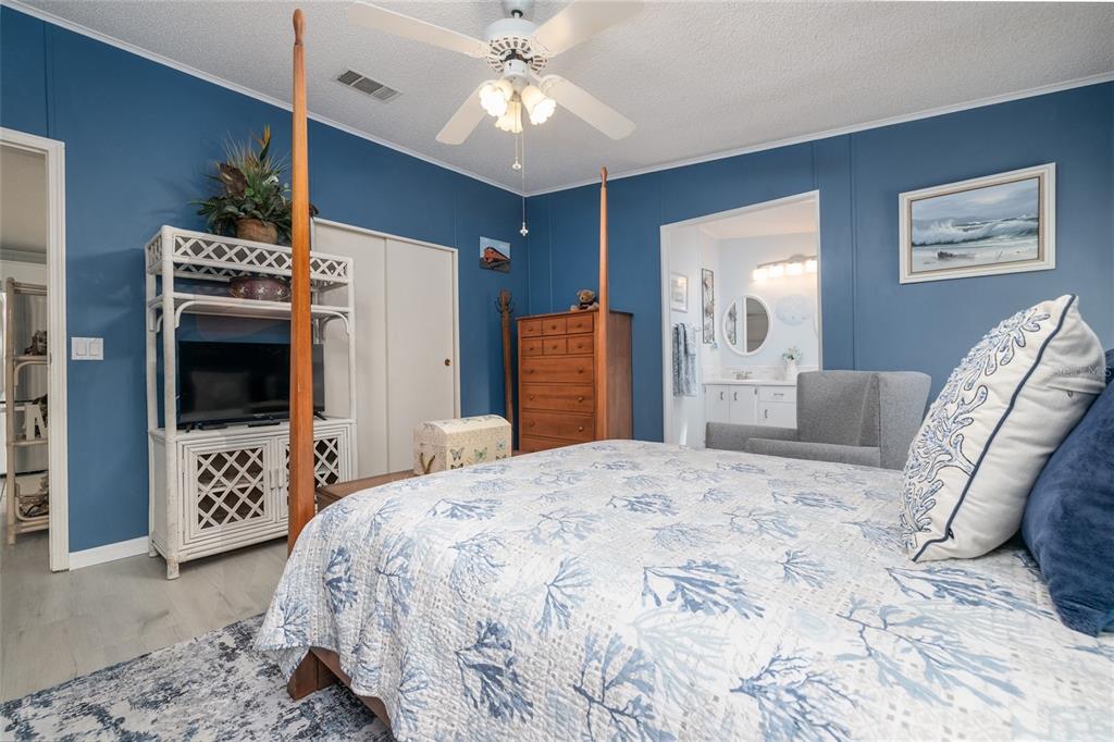 501 Topside Circle Edgewater, FL 32141 - Photo 18 of 47 a bedroom with a bed and a television