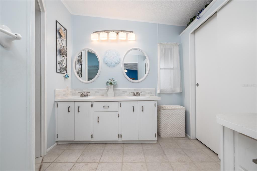 501 Topside Circle Edgewater, FL 32141 - Photo 19 of 47 a bathroom with a sink and a mirror
