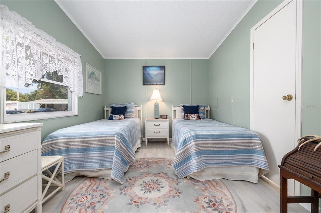 501 Topside Circle Edgewater, FL 32141 - Photo 24 of 47 a bedroom with two beds and a window
