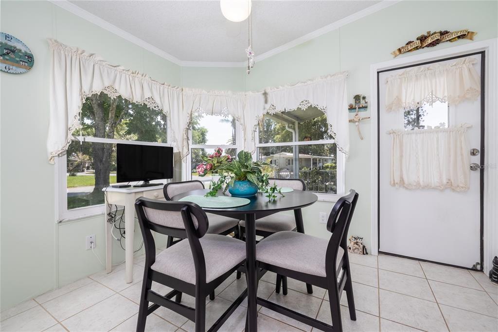 501 Topside Circle Edgewater, FL 32141 - Photo 25 of 47 a view of a dining room with furniture window and outside view