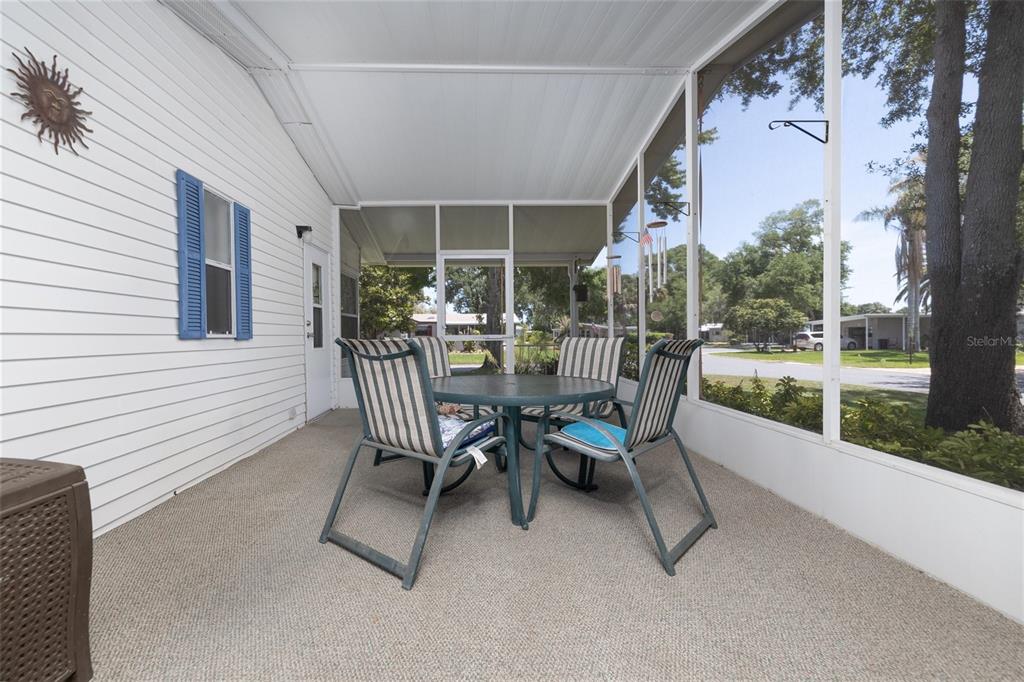 501 Topside Circle Edgewater, FL 32141 - Photo 26 of 47 a view of a patio with a table and chairs