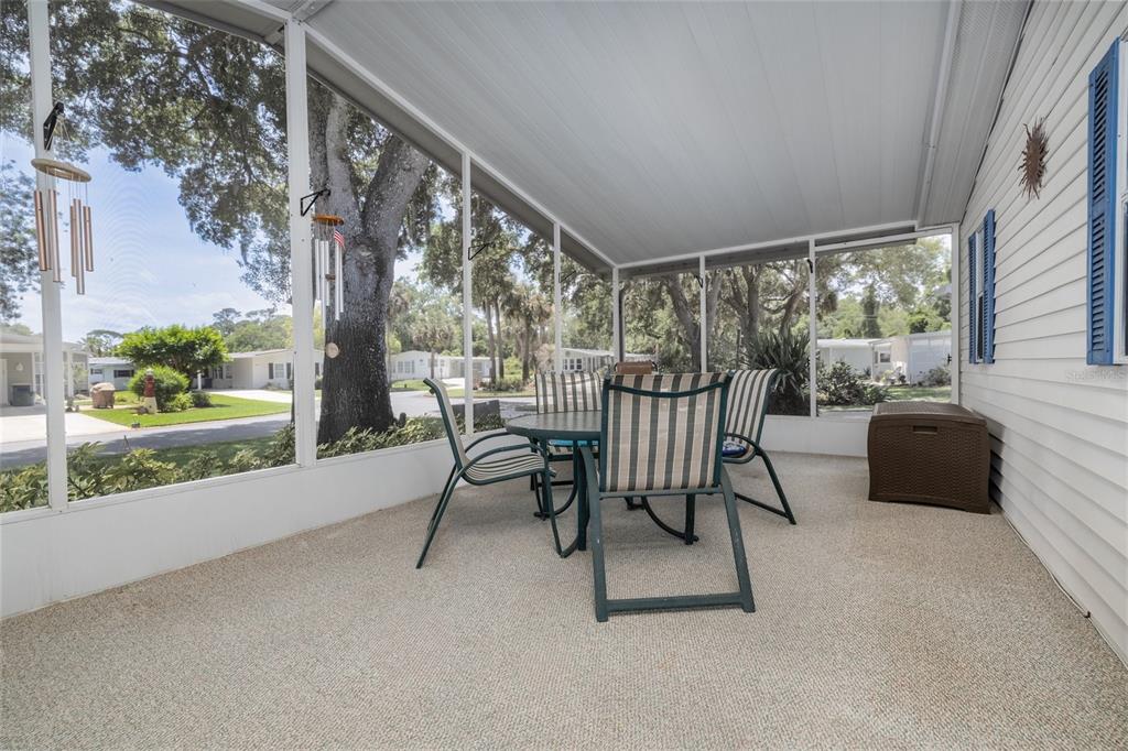 501 Topside Circle Edgewater, FL 32141 - Photo 27 of 47 a view of a porch with furniture and a yard