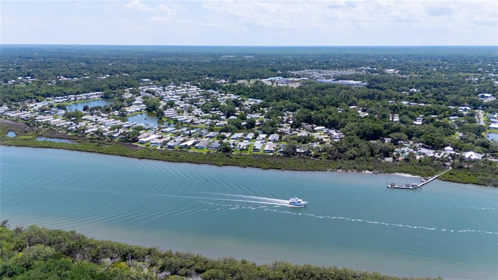 501 Topside Circle Edgewater, FL 32141 - Photo 3 of 47 an aerial view of residential houses with outdoor space and ocean view