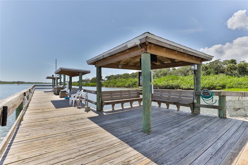 501 Topside Circle Edgewater, FL 32141 - Photo 38 of 47 a view of a roof deck with a table and chairs