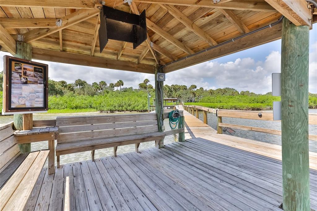 501 Topside Circle Edgewater, FL 32141 - Photo 39 of 47 a view of a wooden deck with a bench