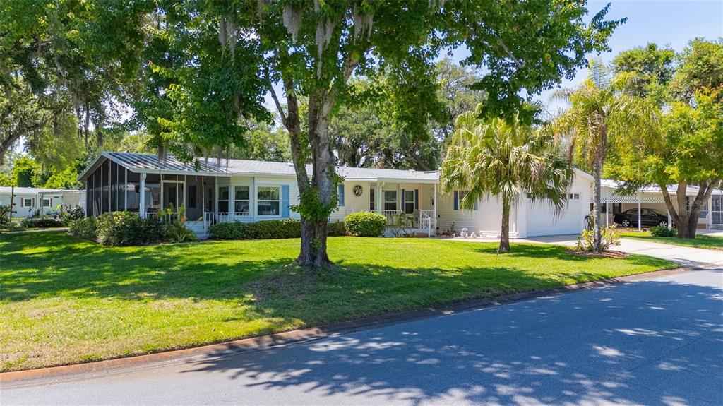 501 Topside Circle Edgewater, FL 32141 - Photo 5 of 47 a front view of a house with a yard