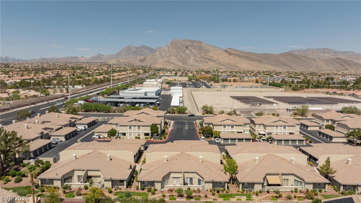 3238 Mystic Ridge Court Las Vegas, NV 89129 - Photo 30 of 31 An aerial panorama reveals a vast residential community nestled against a majestic mountain range.