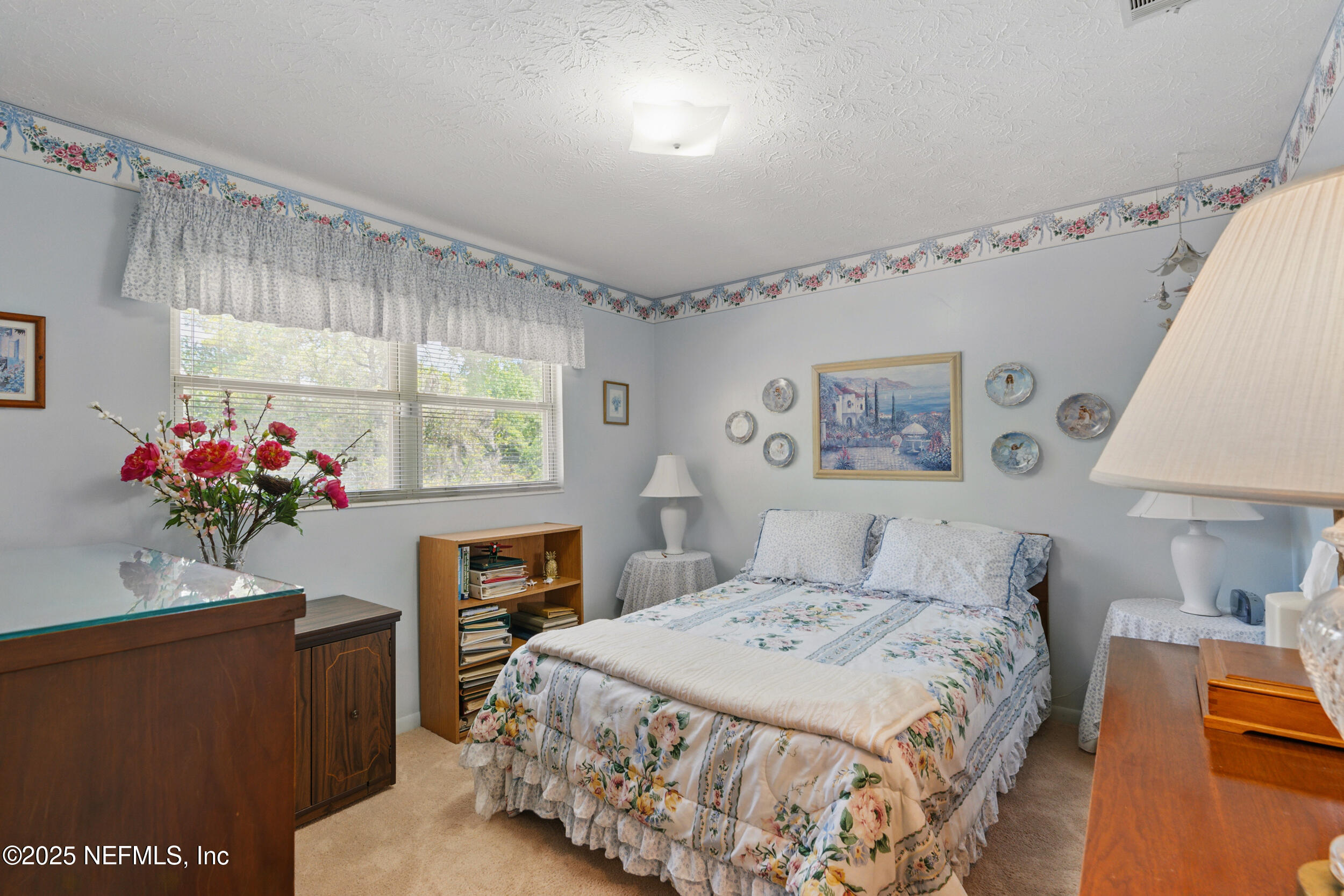 1257 Crown Drive Jacksonville, FL 32221 - Photo 14 of 21 a bedroom with a bed window and a potted plant