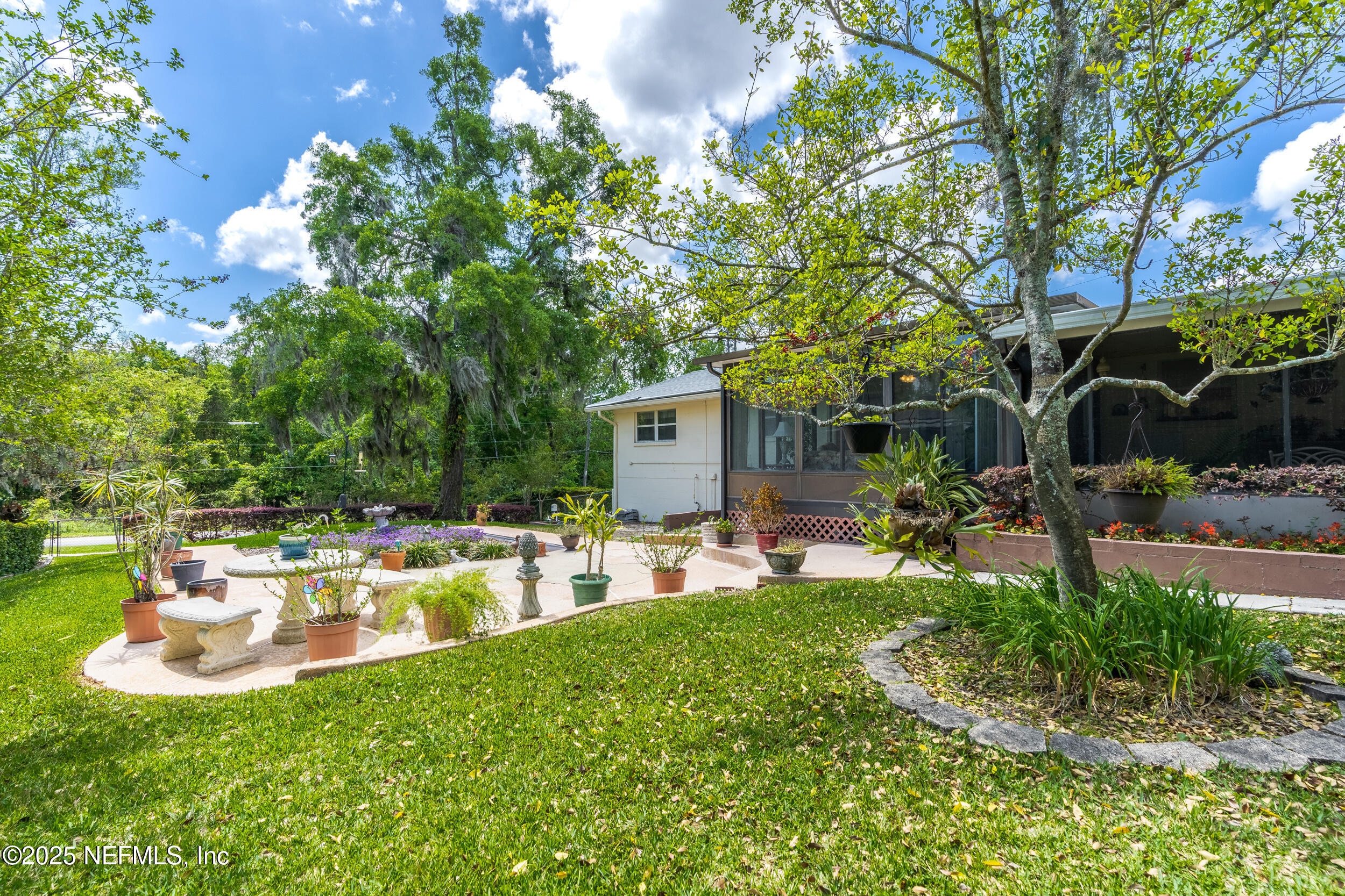 1257 Crown Drive Jacksonville, FL 32221 - Photo 20 of 21 a view of a chair and table in backyard of the house