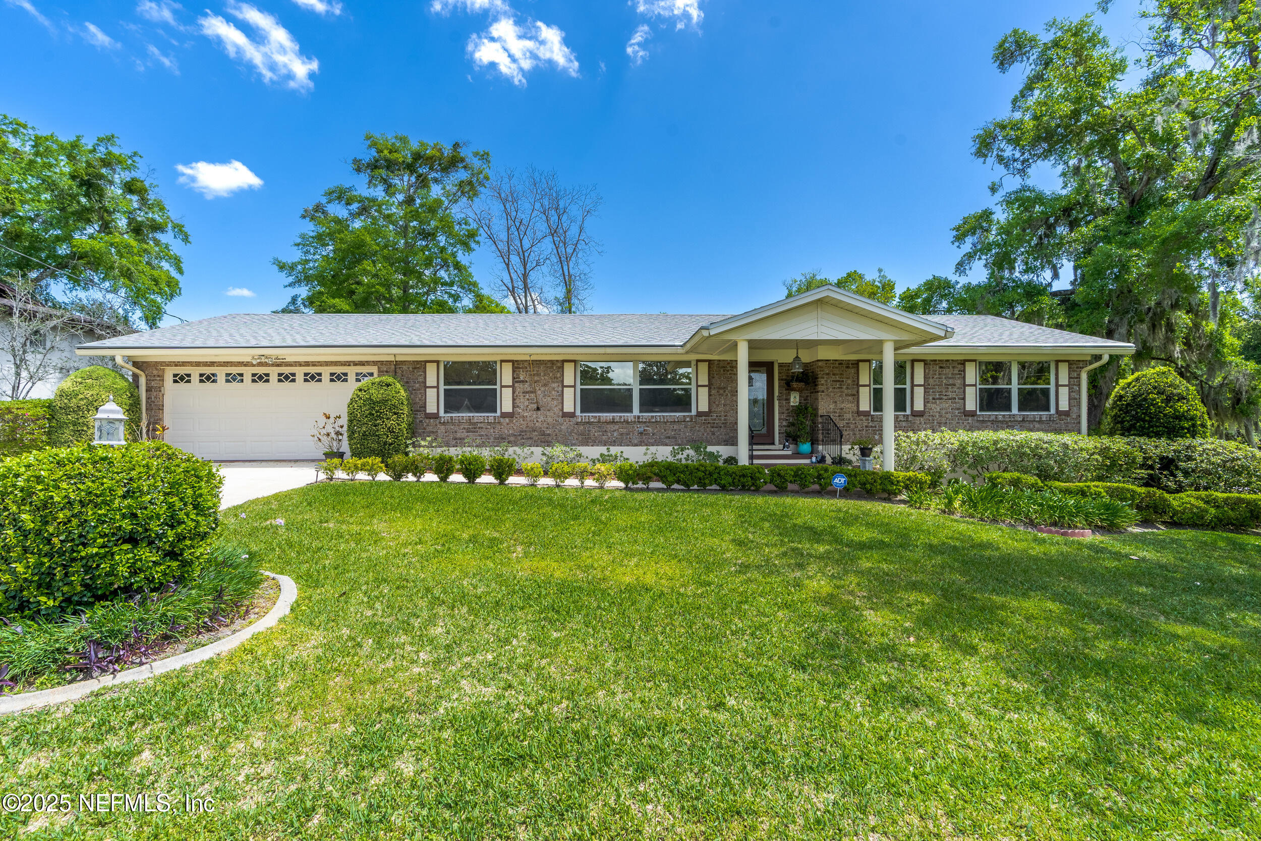 1257 Crown Drive Jacksonville, FL 32221 - Photo 2 of 21 a front view of a house with a yard