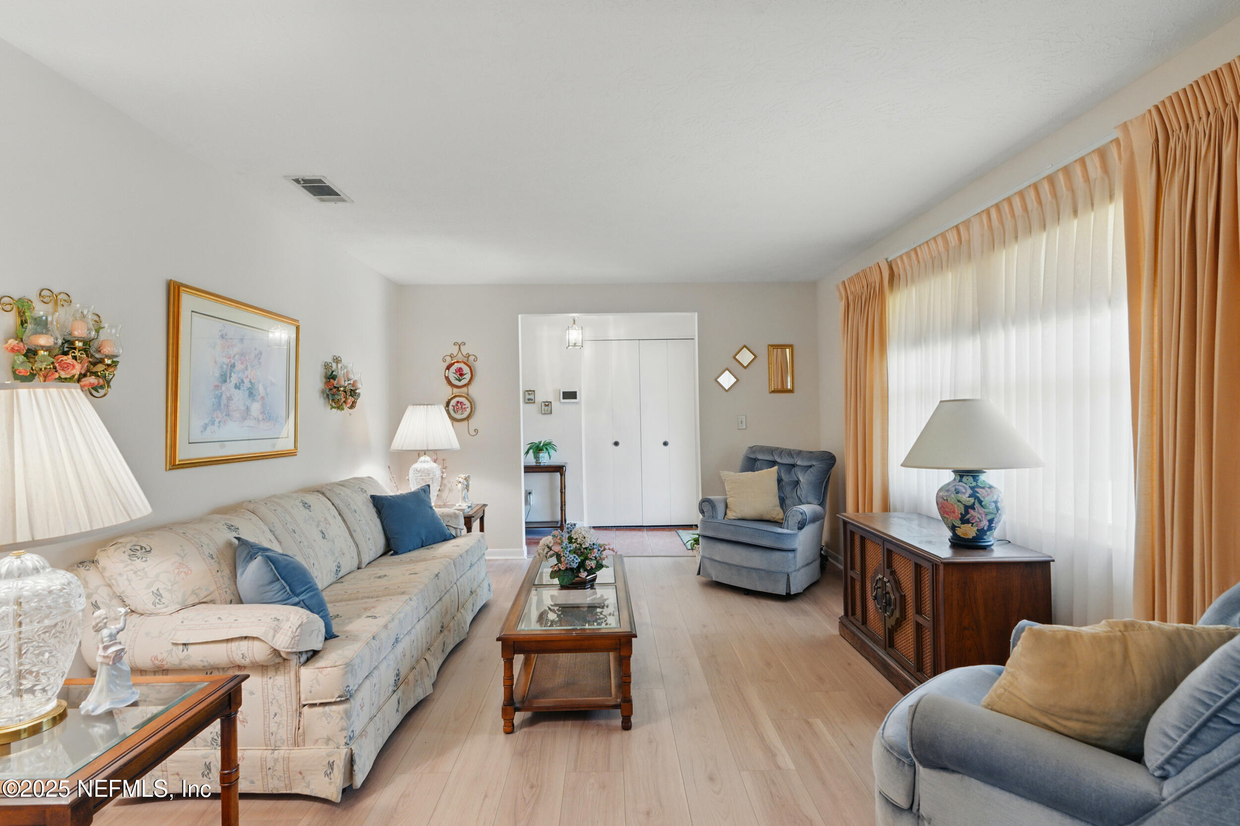 1257 Crown Drive Jacksonville, FL 32221 - Photo 5 of 21 a living room with furniture and a large window