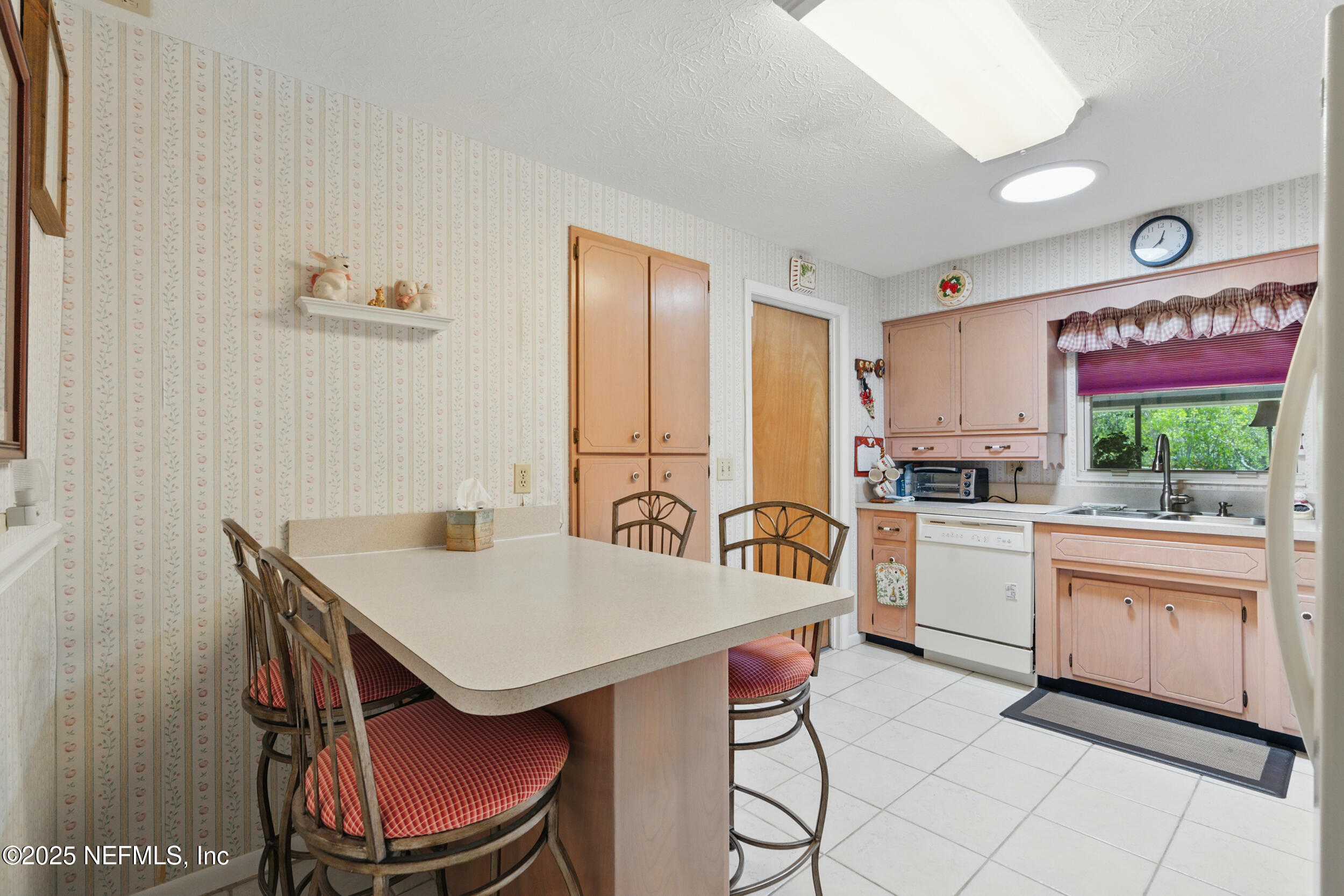 1257 Crown Drive Jacksonville, FL 32221 - Photo 7 of 21 a kitchen with a stove a sink and a refrigerator