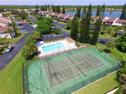 a view of a swimming pool with a yard
