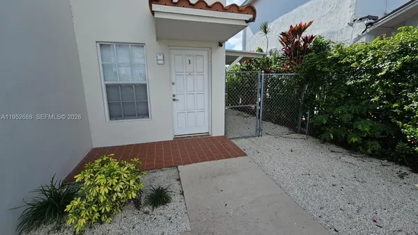a view of outdoor space and yard from a corridor