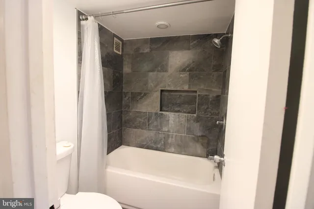 a bathroom with a bathtub