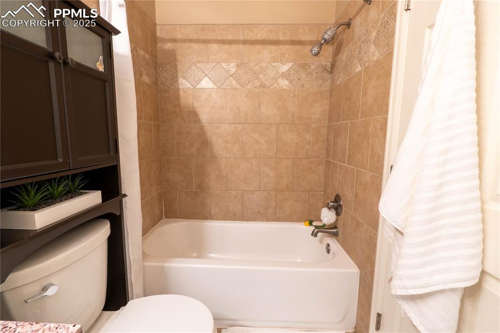 961 Columbine Avenue Colorado Springs, CO 80904 - Photo 20 of 24 a bathroom with a bathtub and shower