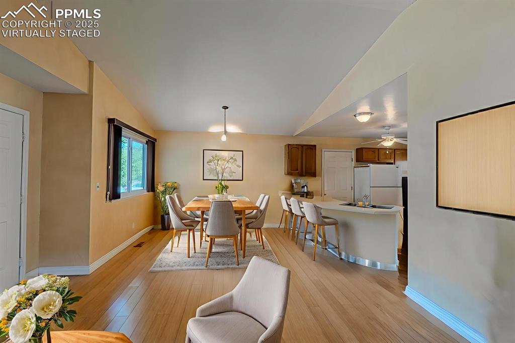 961 Columbine Avenue Colorado Springs, CO 80904 - Photo 6 of 24 a view of a dining room with furniture window and wooden floor