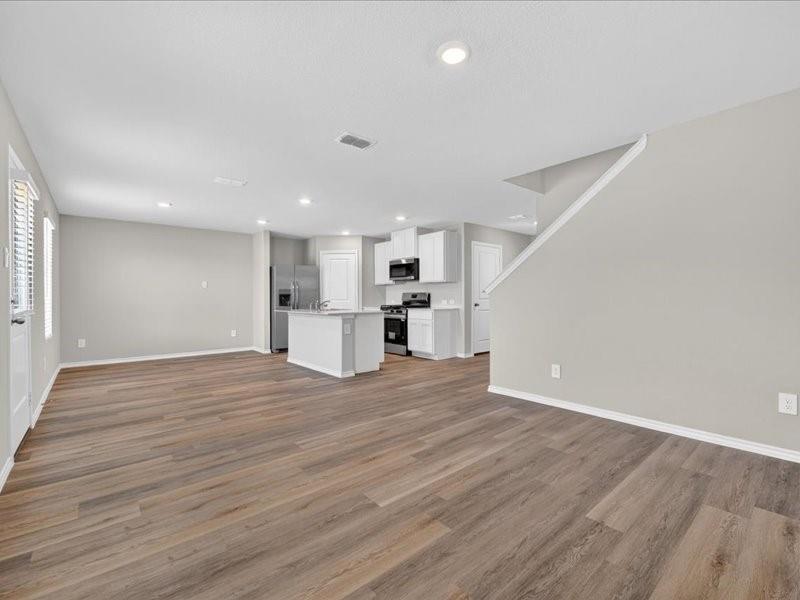 5568 Corduroy Road Krum, TX 76249 - Photo 2 of 23 a view of empty room with wooden floor and window