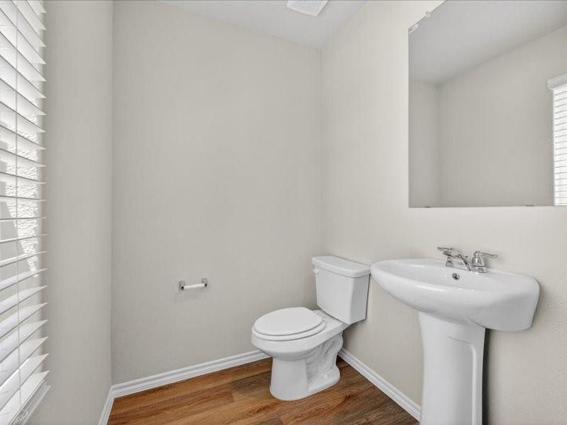 5568 Corduroy Road Krum, TX 76249 - Photo 10 of 23 a bathroom with a sink toilet and a mirror