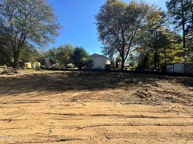 a view of outdoor space with trees all around