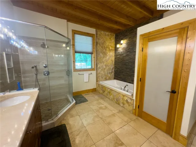 a bathroom with a bathtub and a shower