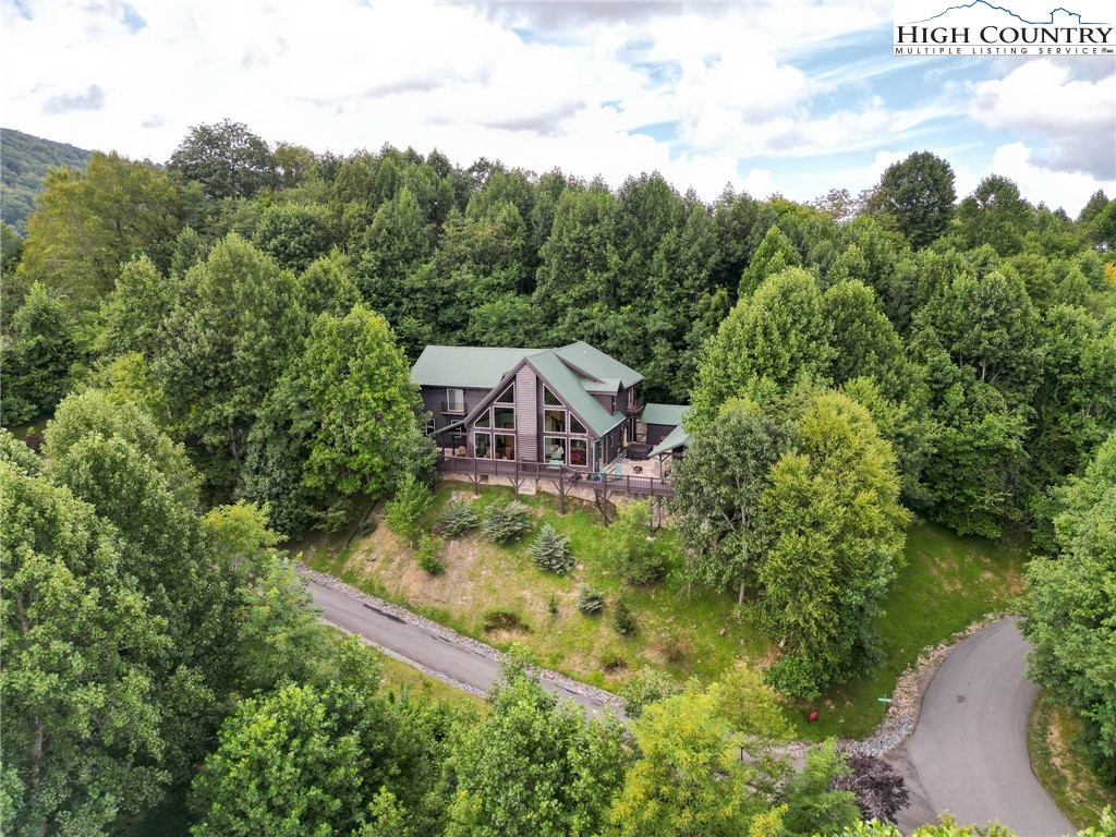 150 Tuscany Ridge Sugar Grove, NC 28679 - Photo 2 of 45 an aerial view of a house with a yard